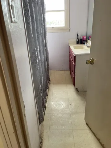 a bathroom with a sink and mirror