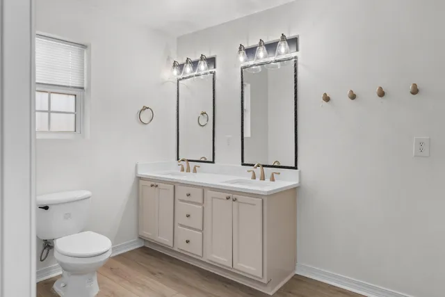 a view of a livingroom with furniture and a potted plant