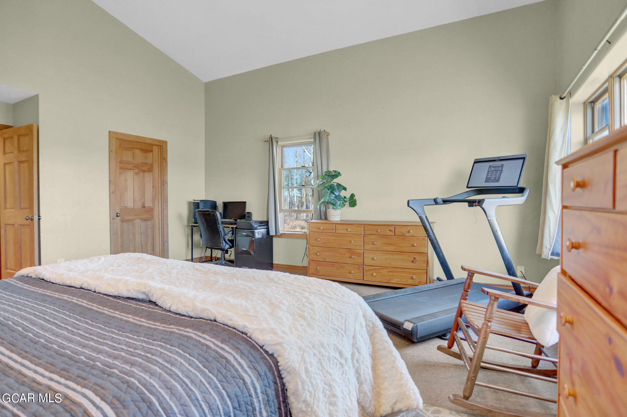 91 3rd Avenue Parshall, CO 80468 - Photo 14 of 48 a bedroom with a bed and wooden floor