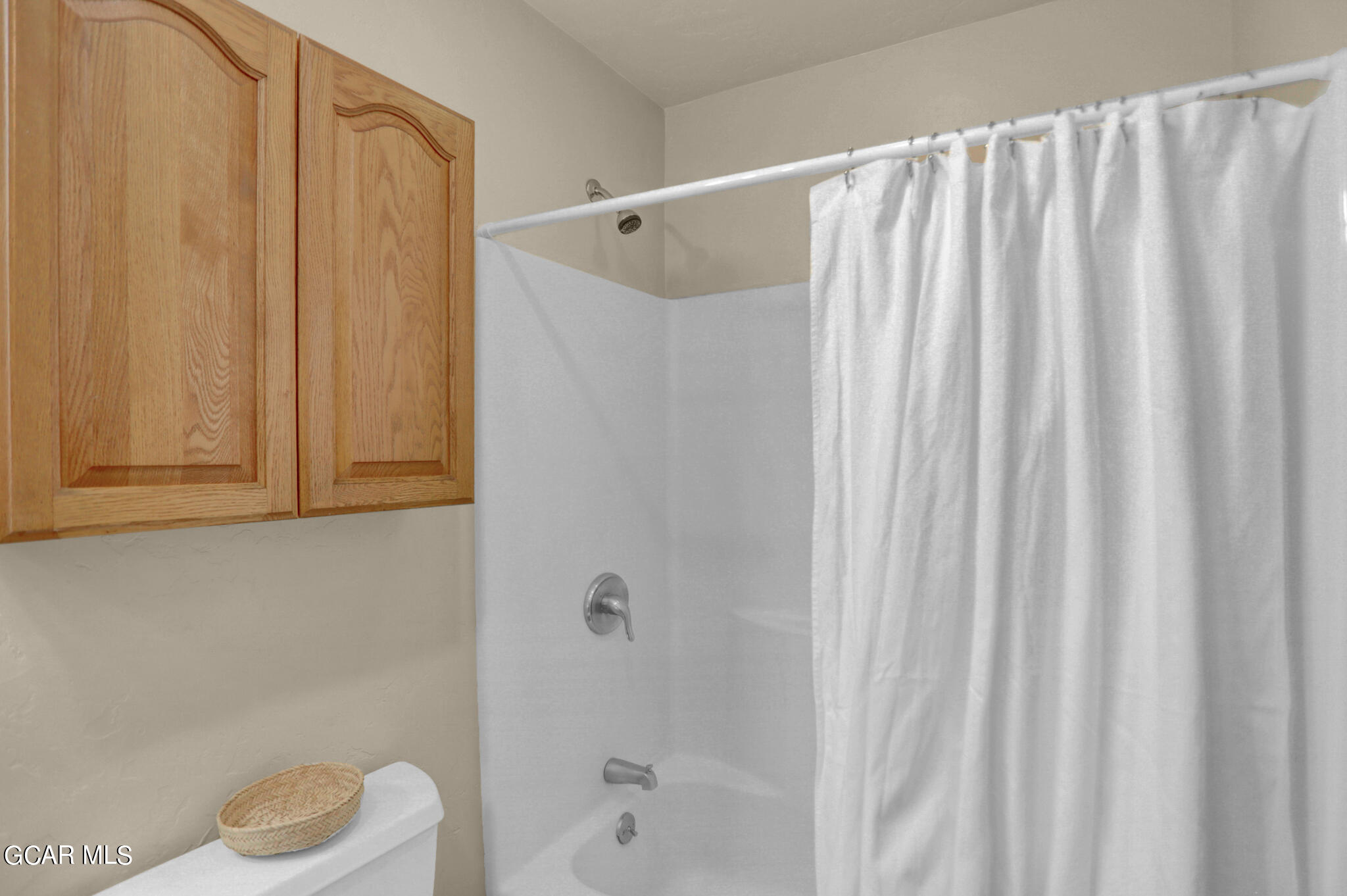 91 3rd Avenue Parshall, CO 80468 - Photo 21 of 48 a bathroom with a shower curtain and a sink