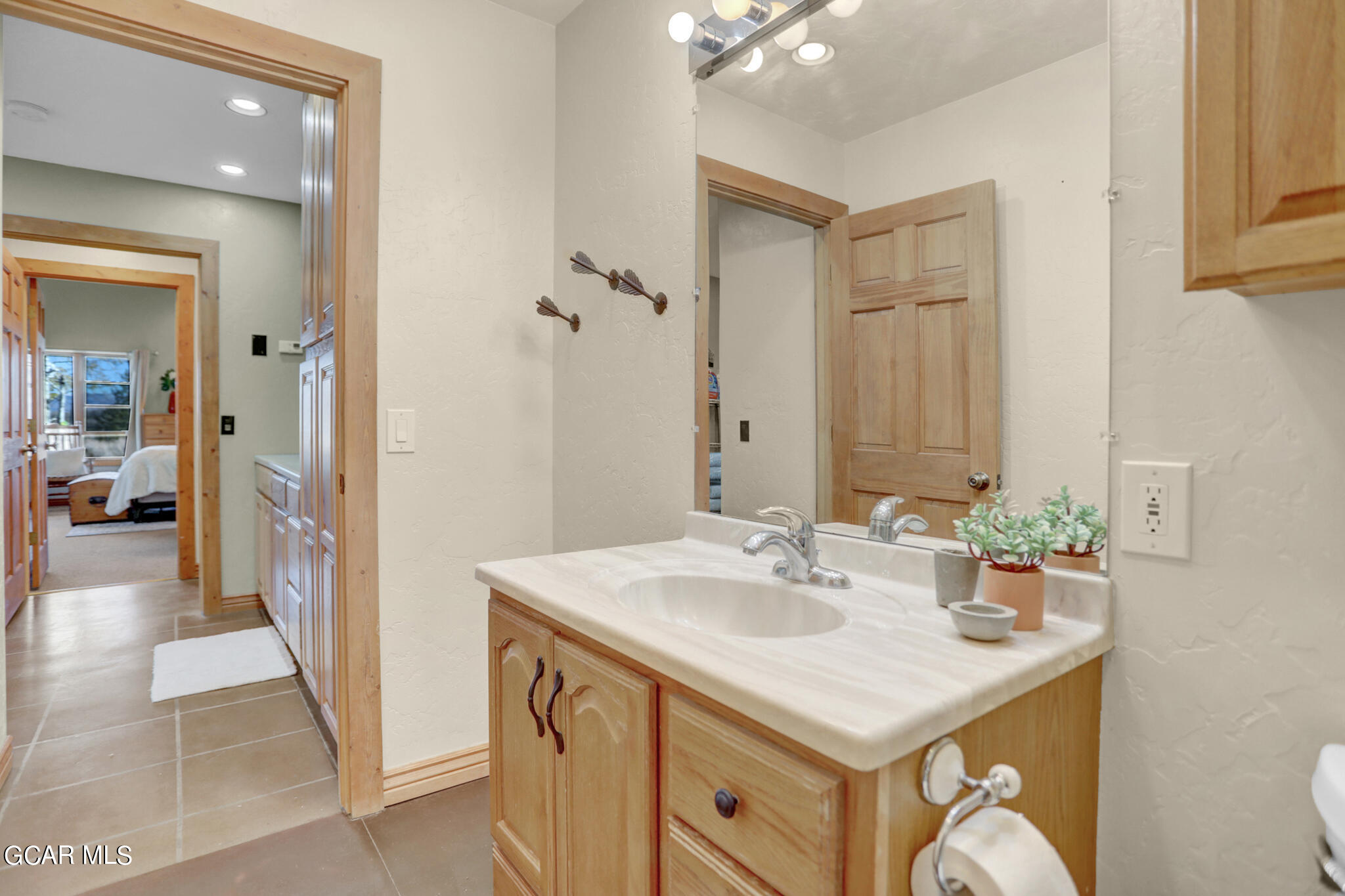 91 3rd Avenue Parshall, CO 80468 - Photo 22 of 48 a en suite bathroom with a sink and a mirror