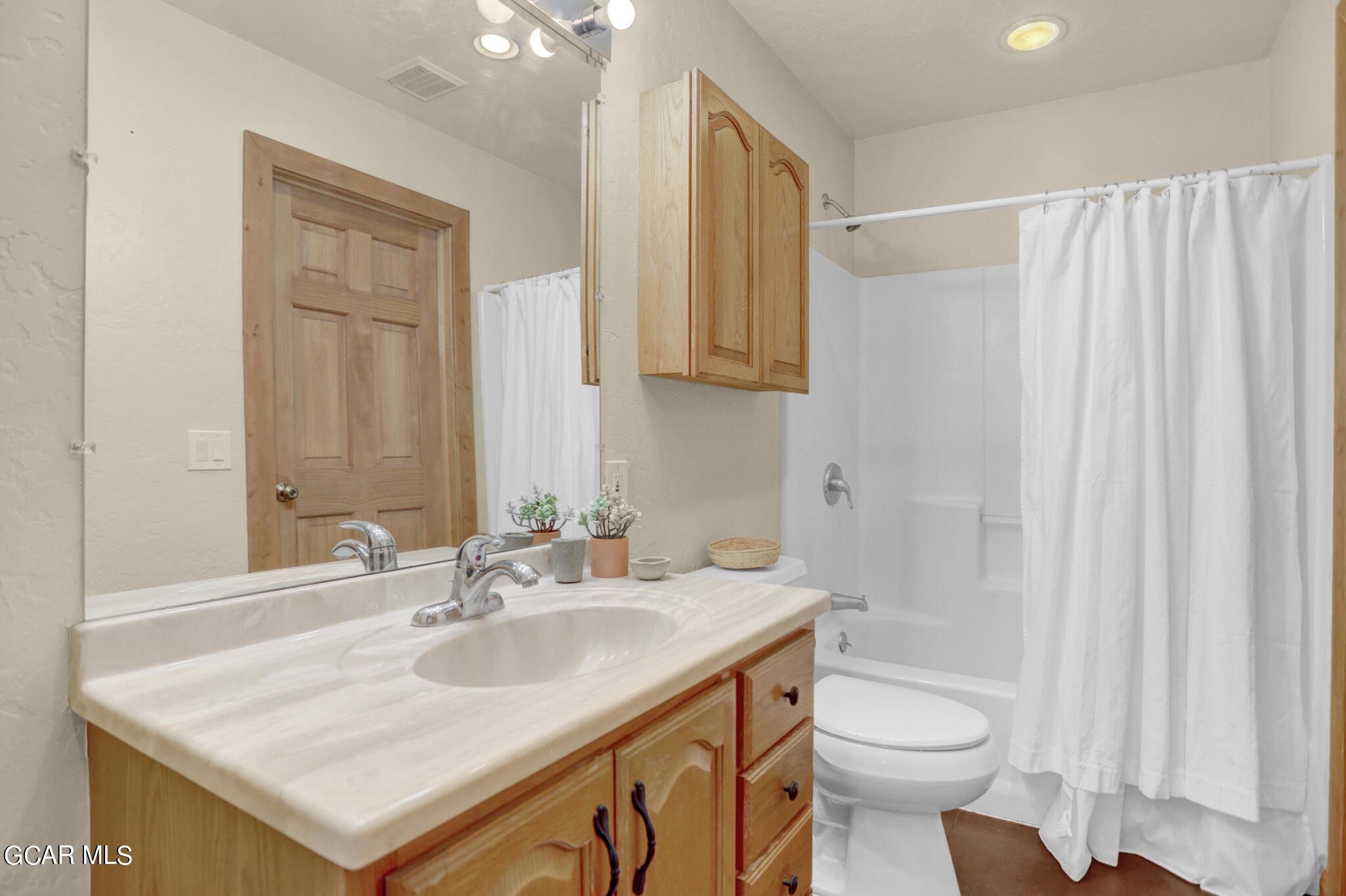 91 3rd Avenue Parshall, CO 80468 - Photo 23 of 48 a bathroom with a sink toilet a mirror and vanity