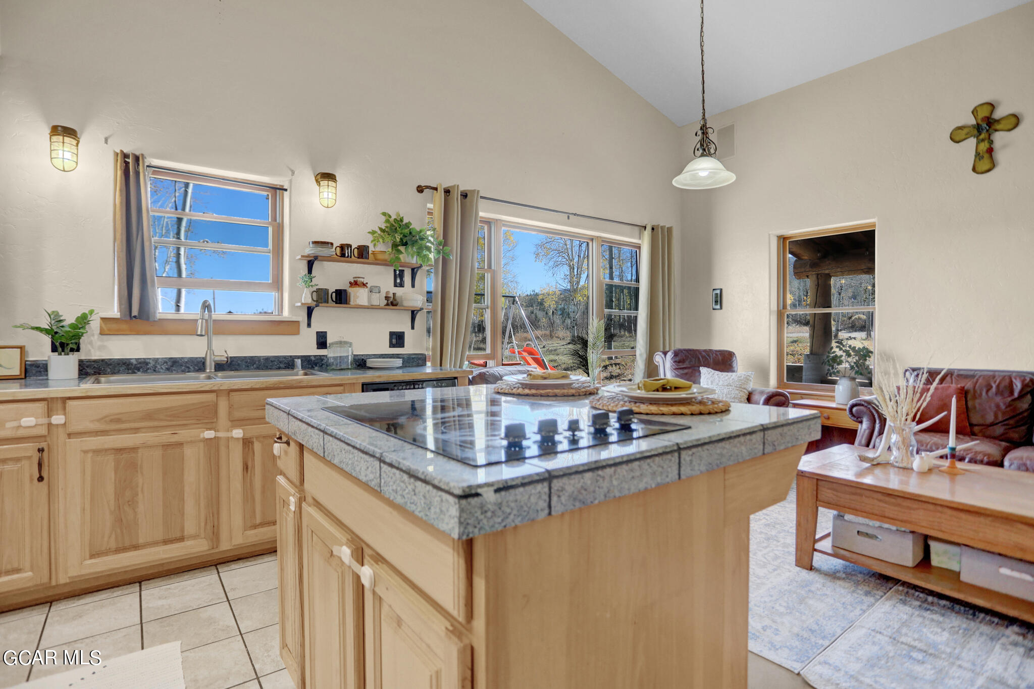 91 3rd Avenue Parshall, CO 80468 - Photo 4 of 48 a kitchen with stainless steel appliances granite countertop a sink and a stove