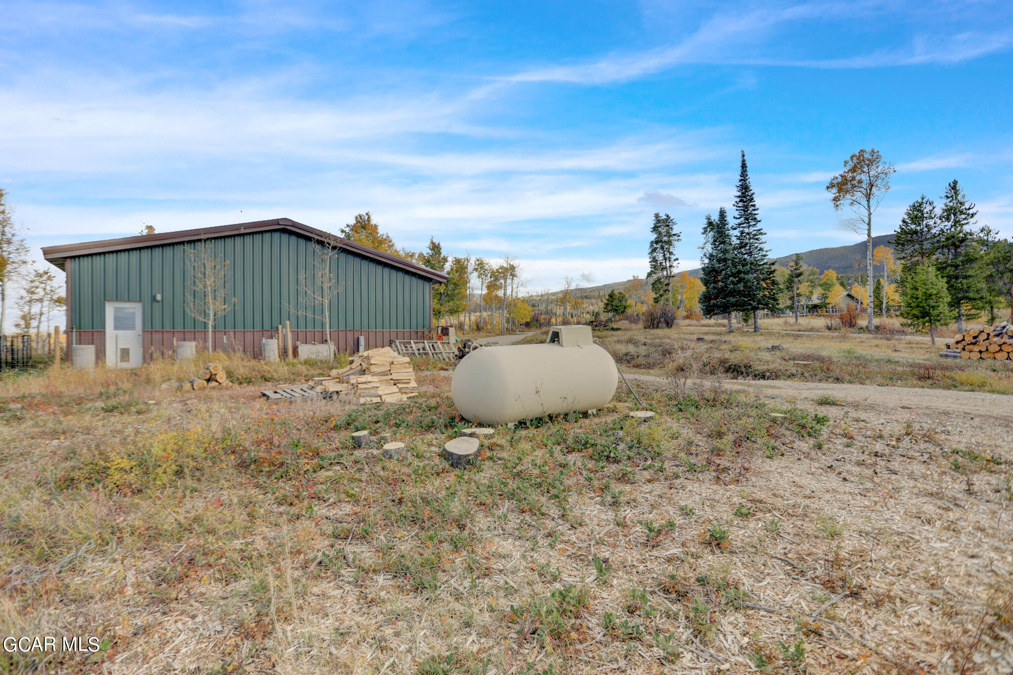 91 3rd Avenue Parshall, CO 80468 - Photo 47 of 48 a backyard of a house with table and chairs