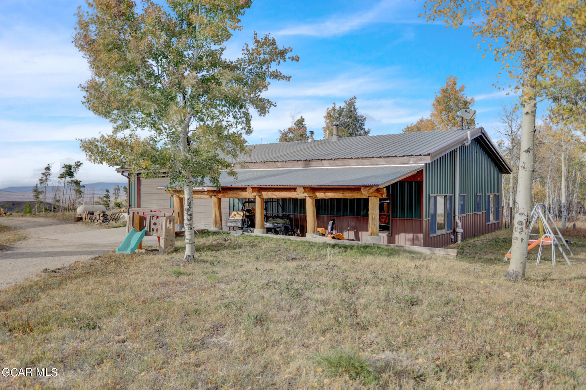 91 3rd Avenue Parshall, CO 80468 - Photo 48 of 48 a view of a house with a yard and sitting area
