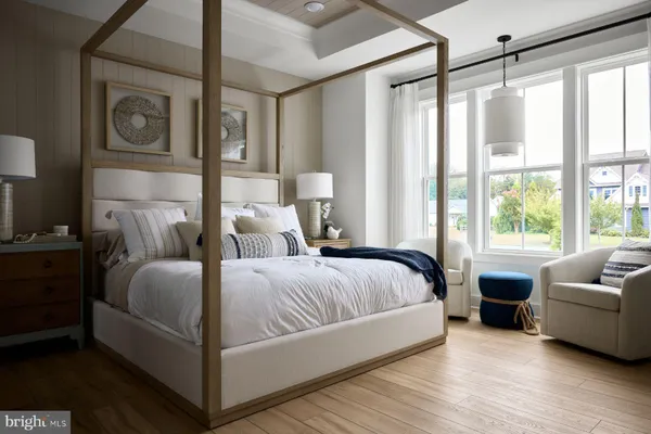 a spacious bedroom with a bed and a couch