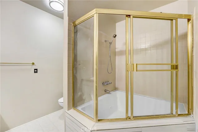 a bathroom with a glass shower door