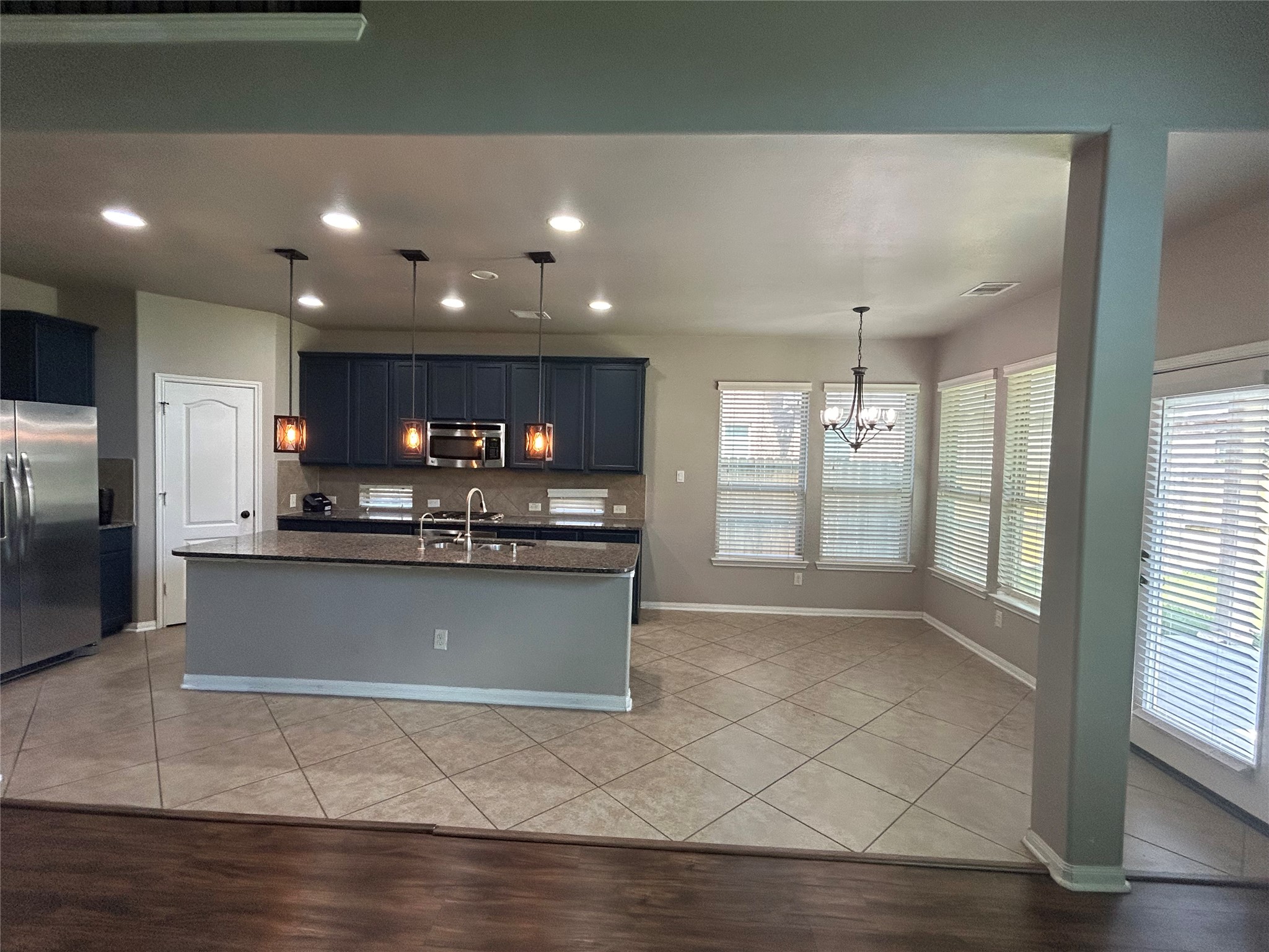 7936 Lake Commons Drive Rosenberg, TX 77469 - Photo 33 of 33 Gorgeous Open Floor Plan displaying the open Kitchen and Breakfast Area With all stainless steel appliances.