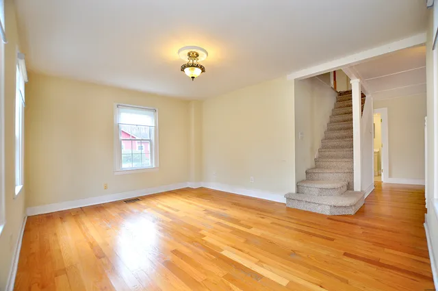 a view of an empty room with a window