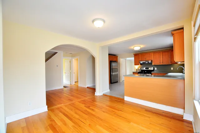 a kitchen with stainless steel appliances granite countertop a sink and a stove