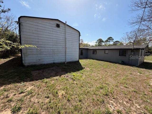 1701 Raleigh Avenue Daytona Beach, FL 32117 - Photo 14 of 16 a view of a backyard of the house