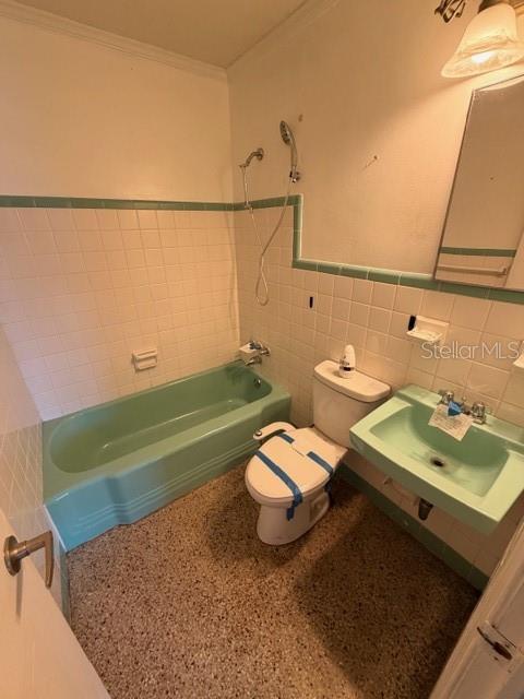 1701 Raleigh Avenue Daytona Beach, FL 32117 - Photo 8 of 16 a bathroom with a sink toilet and mirror