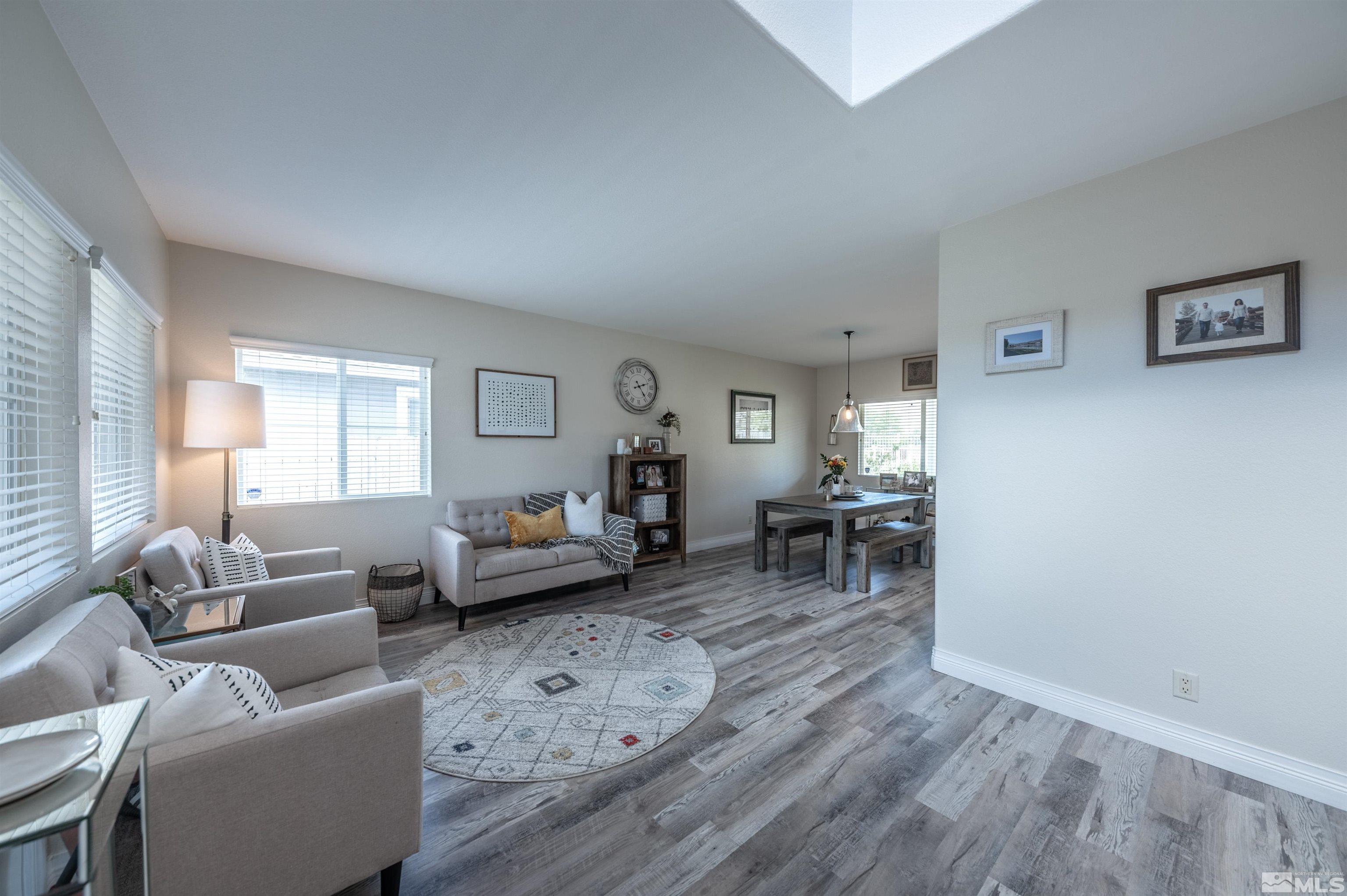 10172 Cascade Falls Court Reno, NV 89521 - Photo 5 of 40 a living room with furniture and a wooden floor