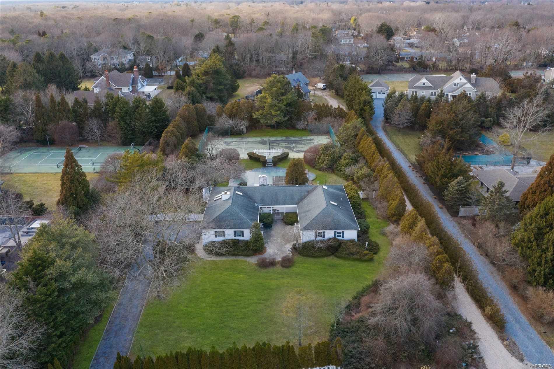 21 Bridle Path Remsenburg, NY 11960 - Photo 1 of 1 an aerial view of residential houses with outdoor space and swimming pool