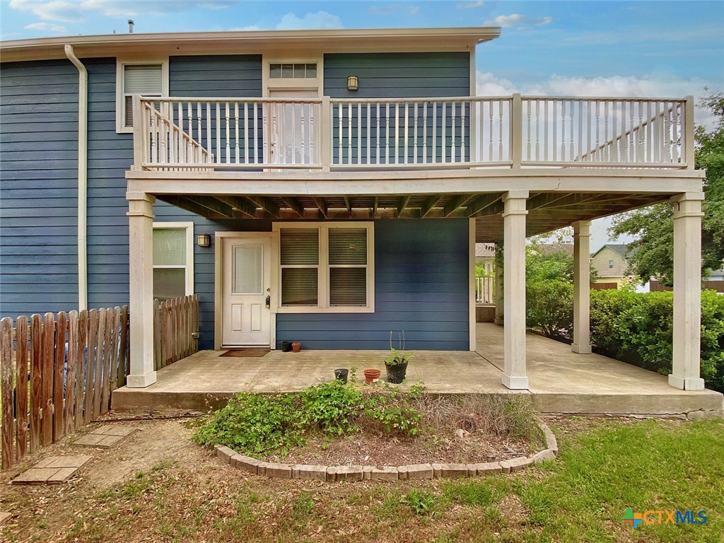 518 Shadow Point, Unit C San Marcos, TX 78666 - Photo 1 of 1 a front view of a house with garden