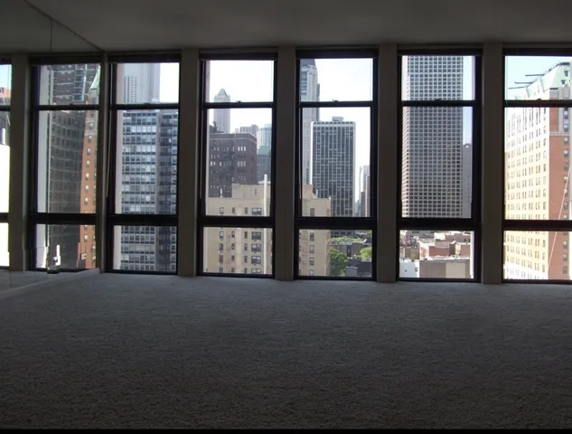 a view of an empty room with windows