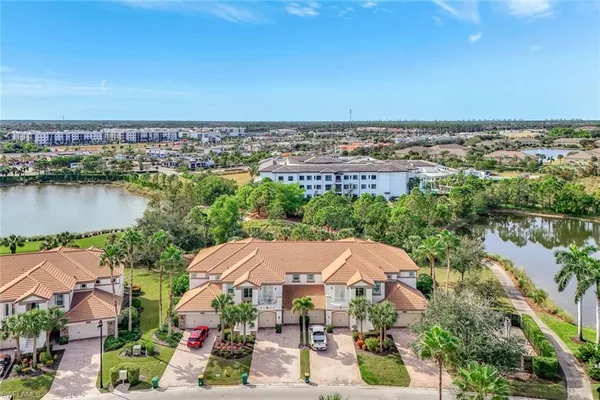 an aerial view of a house with a lake view