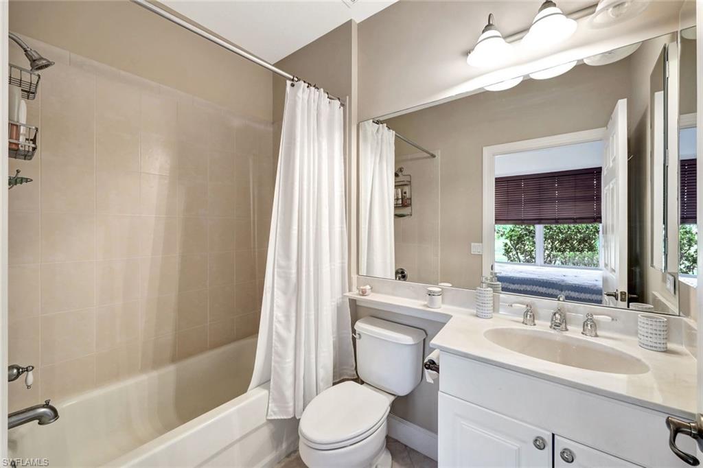 9193 Quartz Lane, Unit 102 Naples, FL 34120 - Photo 27 of 50 a bathroom with a sink a toilet and a bathtub