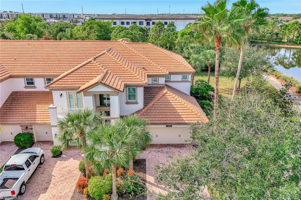 9193 Quartz Lane, Unit 102 Naples, FL 34120 - Photo 3 of 50 a aerial view of a house next to a lake view
