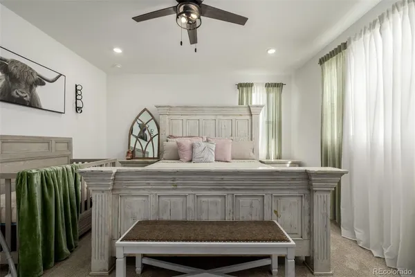 a room with a table chairs and a chandelier