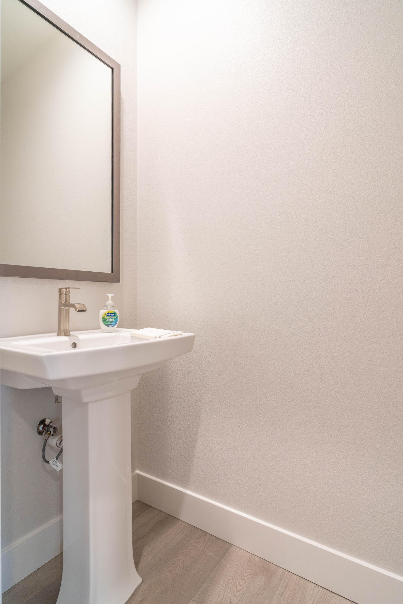 51580 Whiptail Drive Indio, CA 92201 - Photo 23 of 28 a bathroom with a sink a mirror and shower