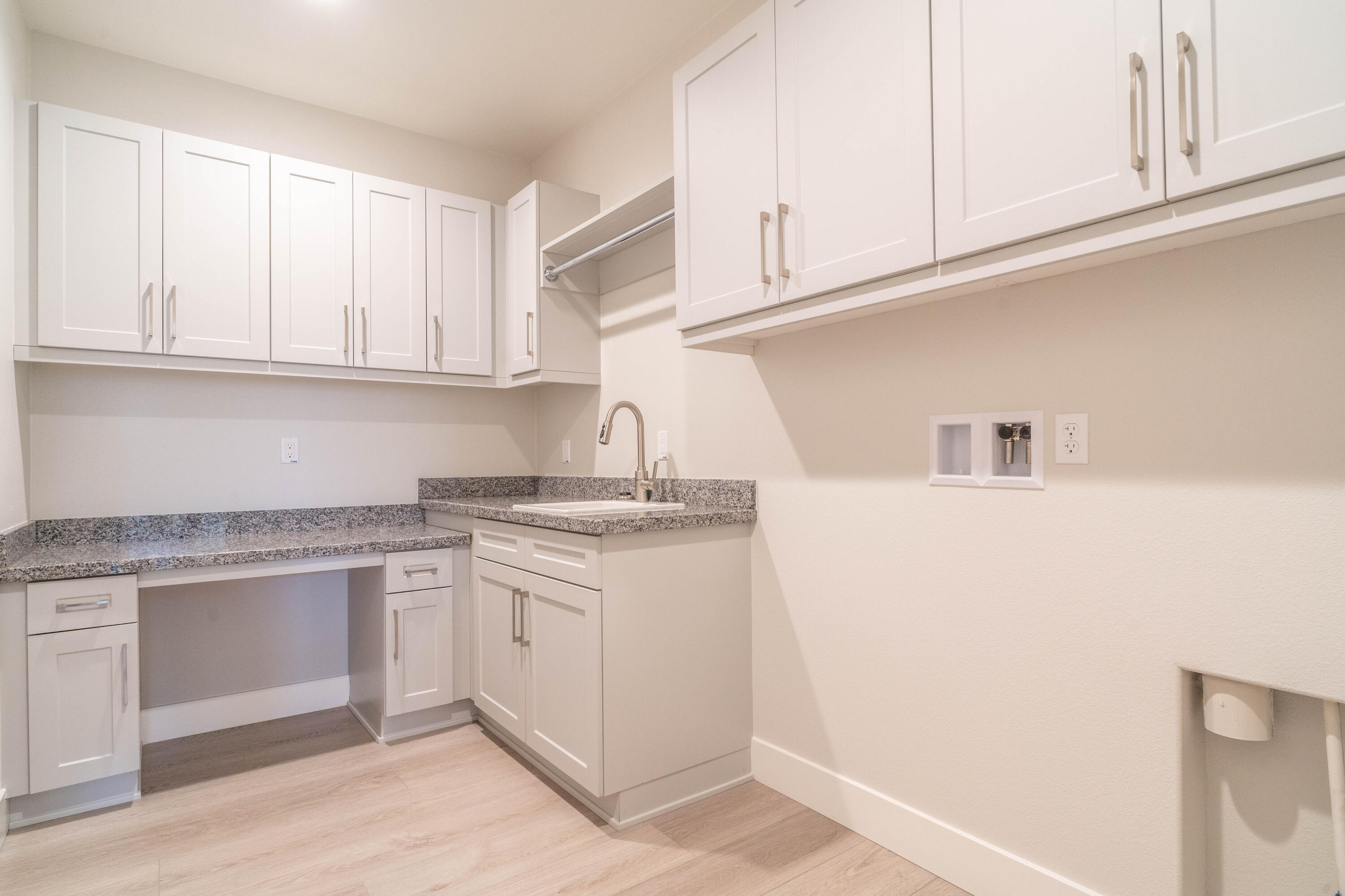 51580 Whiptail Drive Indio, CA 92201 - Photo 24 of 28 a kitchen with stainless steel appliances granite countertop a sink and dishwasher with white cabinets