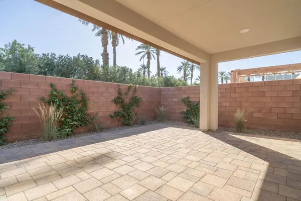 a house with palm trees in front of it
