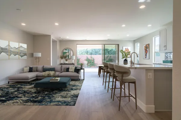 a kitchen with granite countertop white cabinets stainless steel appliances and sink