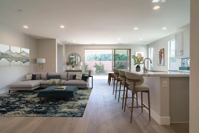 a kitchen with granite countertop white cabinets stainless steel appliances and sink