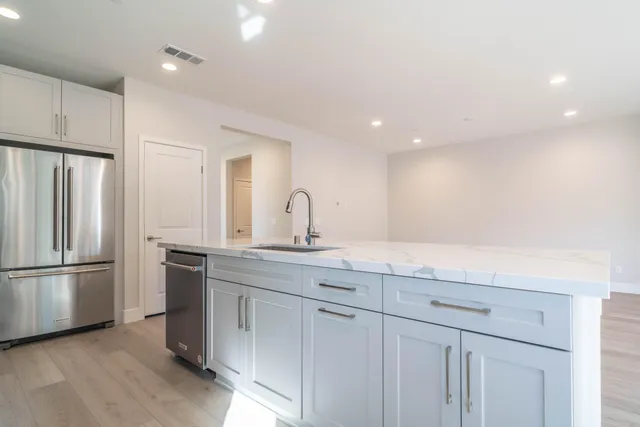 a view of a kitchen with electric appliances
