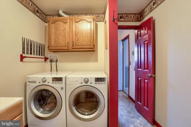 a utility room with dryer and washer