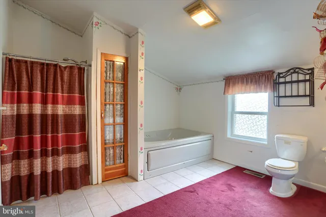 a bathroom with a bathtub sink and toilet