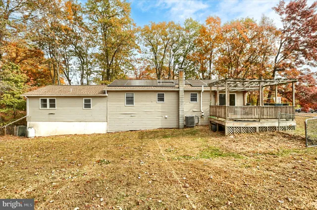 a house with trees in the background