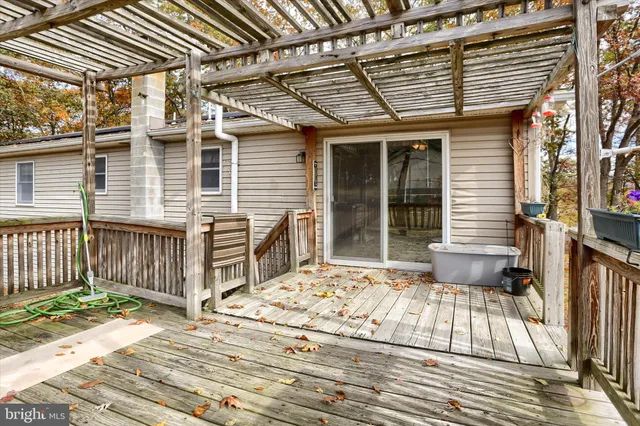 a view of a patio with a table and chairs