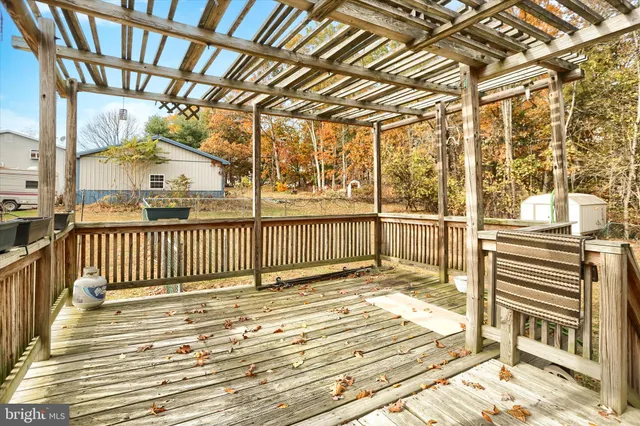 a view of a porch with wooden floor
