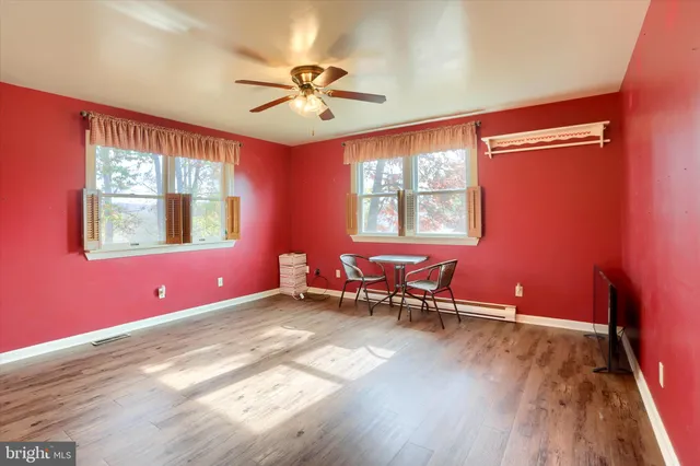 a view of a livingroom with furniture window and wooden floor