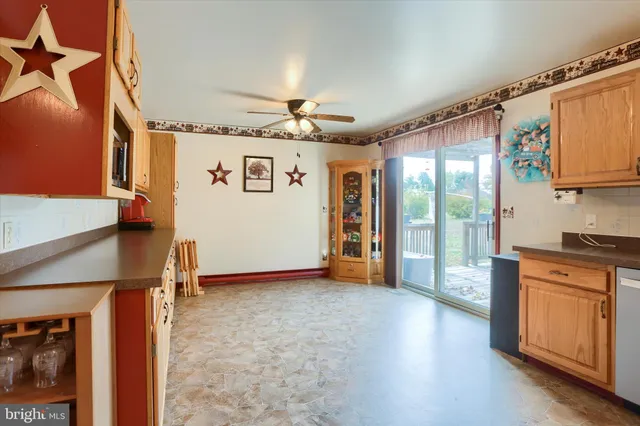 a view of a kitchen with a sink and a refrigerator