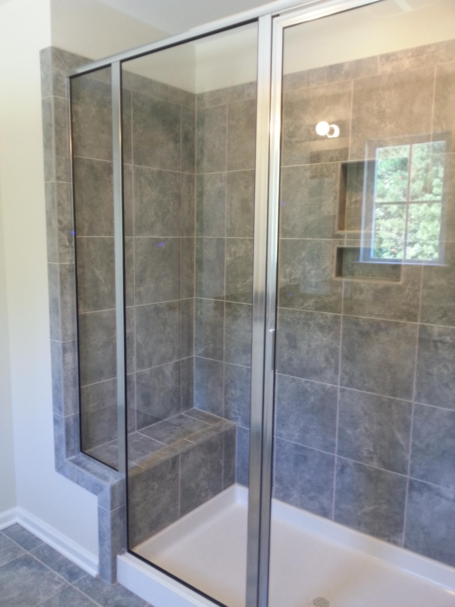 114 Cypress Plantation Road Moncks Corner, SC 29461 - Photo 12 of 17 Tiled shower with built-in bench in Mast