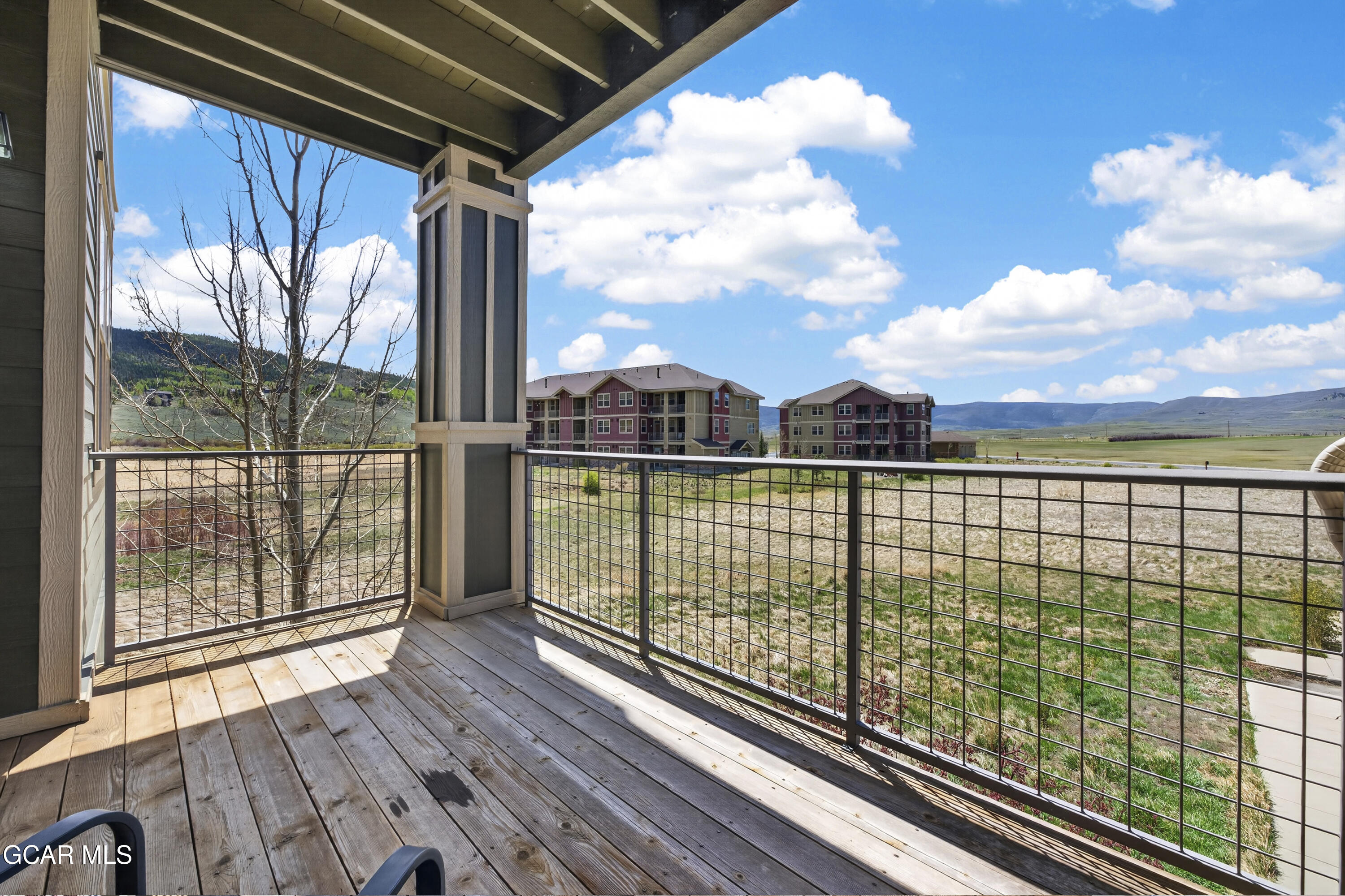 160 Village Road, Unit F207 Granby, CO 80446 - Photo 20 of 28 a view of a balcony with an outdoor space