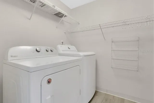 a utility room with dryer and washer