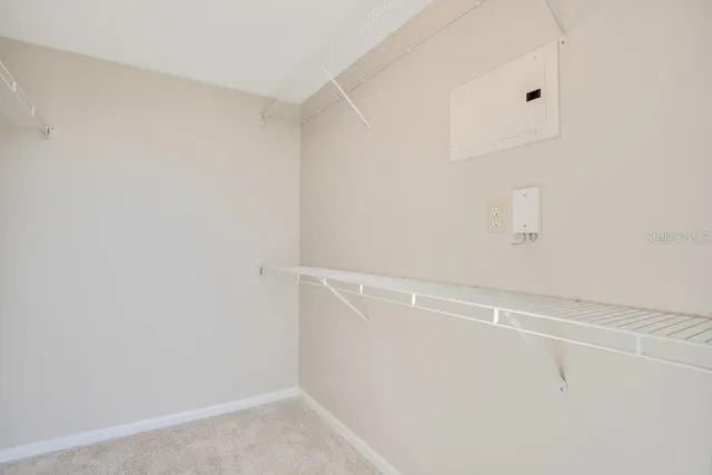 a view of a livingroom with a ceiling fan and window