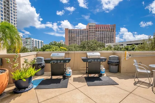 a view of a swimming pool with a lounge chairs in front of a building