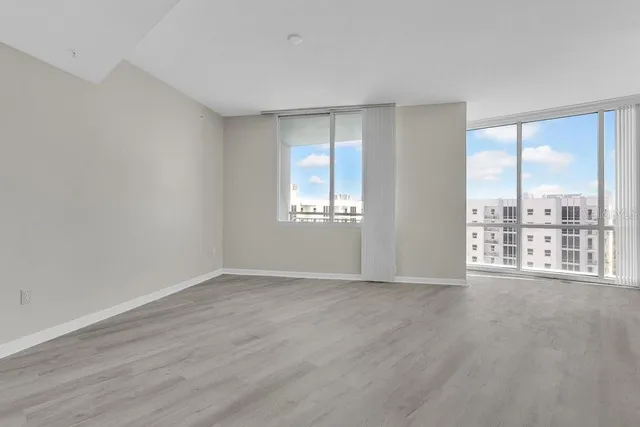 a view of an empty room with a window