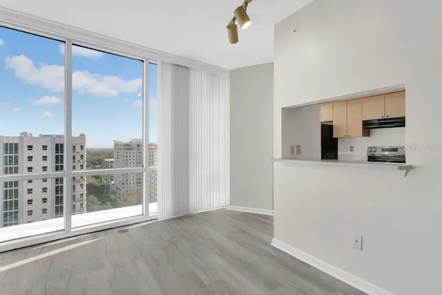 a view of a kitchen with furniture and a window