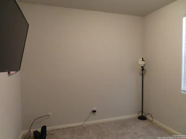 a view of a room with rack on the wall