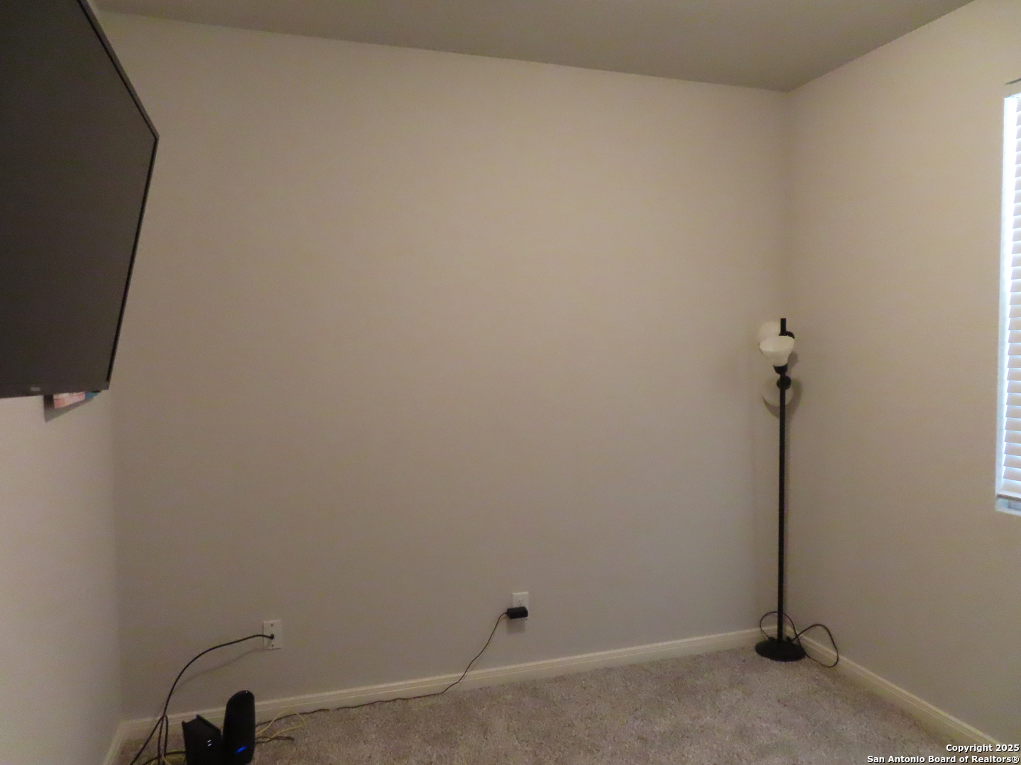 22150 Approach San Antonio, TX 78261 - Photo 3 of 18 a view of a room with rack on the wall