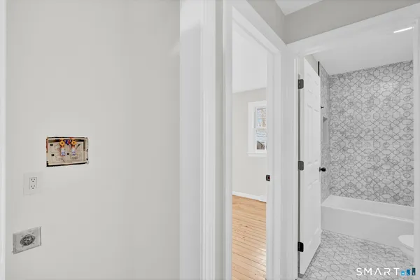 a bathroom with a bathtub and shower