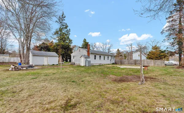 a view of a big yard with a house