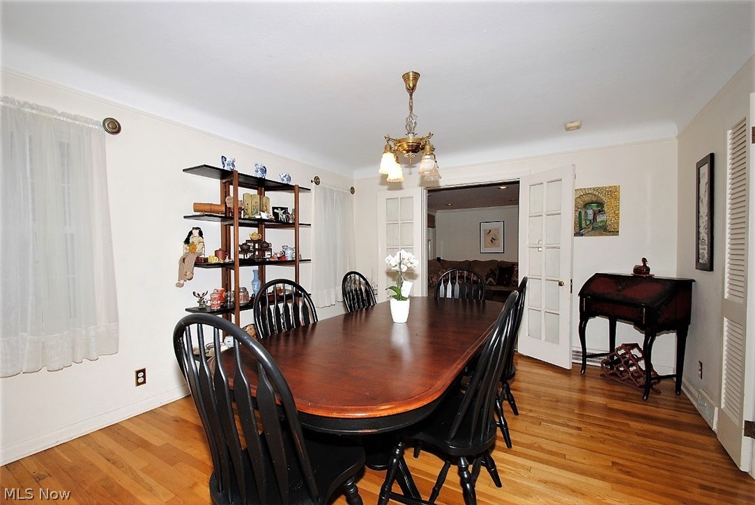 2555 Milton Road Cleveland, OH 44118 - Photo 3 of 14 Formal Dining Room with Hardwood Floors and French Doors leading to first floor family room.