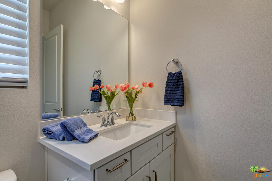 18 Riesling Rancho Mirage, CA 92270 - Photo 13 of 24 a bathroom with a sink and a mirror